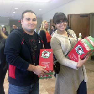 Joe and Kat Koppie take home shoeboxes to fill for children. (Photos: Courtesy of the Living Faith Christian Church)
