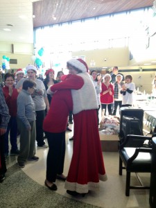 Brewer shares an emotional hug with one of the special needs adults from the AHRC