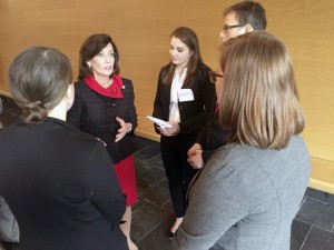 Lt. Gov. Kathy Hochul (center) meets with students following a round-table discussion.