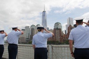 Coast Guardsmen aboard USCG cutter Spencer render honors as their ship passes the Freedom Tower on Wednesday, May 20, during the Parade of Ships. (Photo by Christy Hinko)