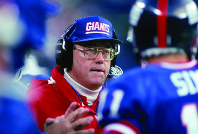 EAST RUTHERFORD, NJ - OCTOBER 28: Running back coach Ray Handley of the New York Giants looks on during a game against the Washington Redskins at Giants Stadium October 28, 1990 in East Rutherford, New Jersey. The Giants won 21-10. (Photo by George Rose/Getty Images)