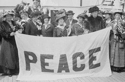 Delegates to the April 1915 Women's International Congress for Peace and Freedom aboard the MS Noordam with their blue and white "PEACE" banner. Rankin was a prominent member of the organization