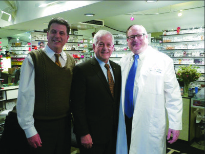 Optician Scott Kornfeld, Assemblyman Chuck Lavine and Dr. Dean Hart.