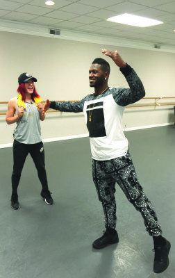 Antonio Brown and partner Sharna Burgess get down to business during rehearsals. (Photo by Adam Raia)