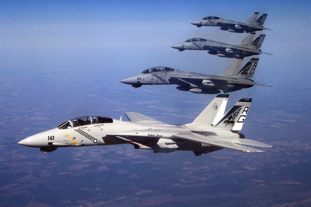 Four F-14B Tomcats, assigned to the “Pukin Dogs” of Fighter Squadron 143, conduct one last flight from Naval Air Station Oceana, VA, before being retired by the squadron. Photo by Lt. Cmdr. Shannon Coulter