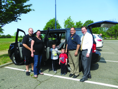 Assemblyman Tom McKevitt with Chris Mistron from the Nassau County Traffic Safety Board and the Collins Family from East Meadow at the assemblyman’s annual Car Seat Safety Check recently held at Eisenhower Park.