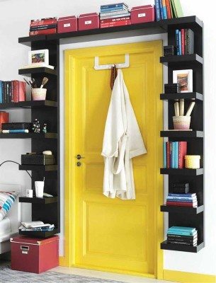 A shelving unit framing the door way is a great use of space.