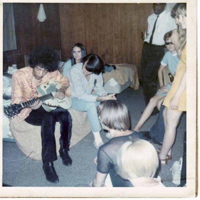 Jimi Hendrix hanging out backstage with The Monkees