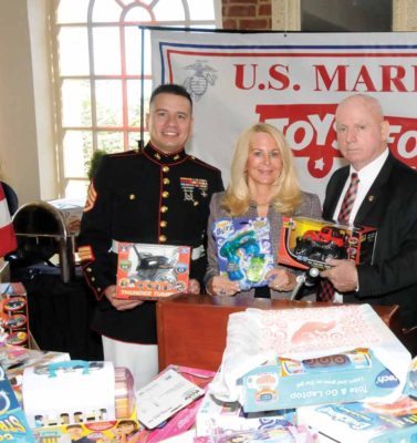 J.D. Quinton, Angela Susan Anton and Chuck Kilbride. Left: Freeport students stole the show at the Toys For Tots campaign kick-off. 