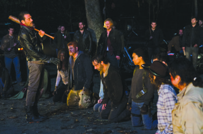 Season 7 kicks off solving a major cliffhanger where uber villain Negan (Jeffrey Dean Morgan, far left) decides which member of The Walking Dead cast he'll be making an extreme fatal example out of. (Photo Credit: Gene Page/AMC)